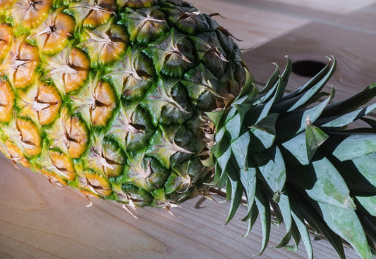 Closeup of pineapple on wooden table
