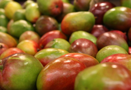 Unpeeled mangoes
