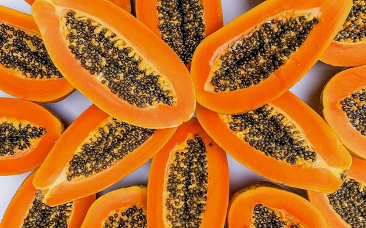 Several halves of papayas in a star shape