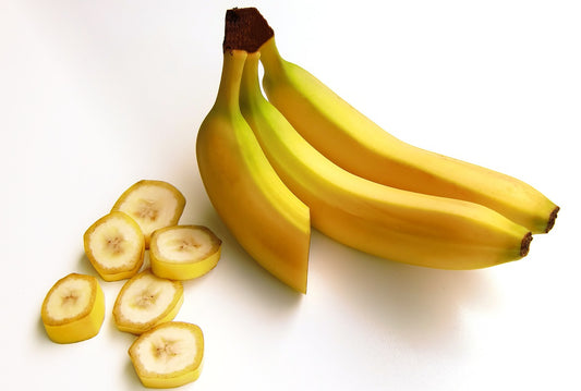 A bunch of bananas with banana slices