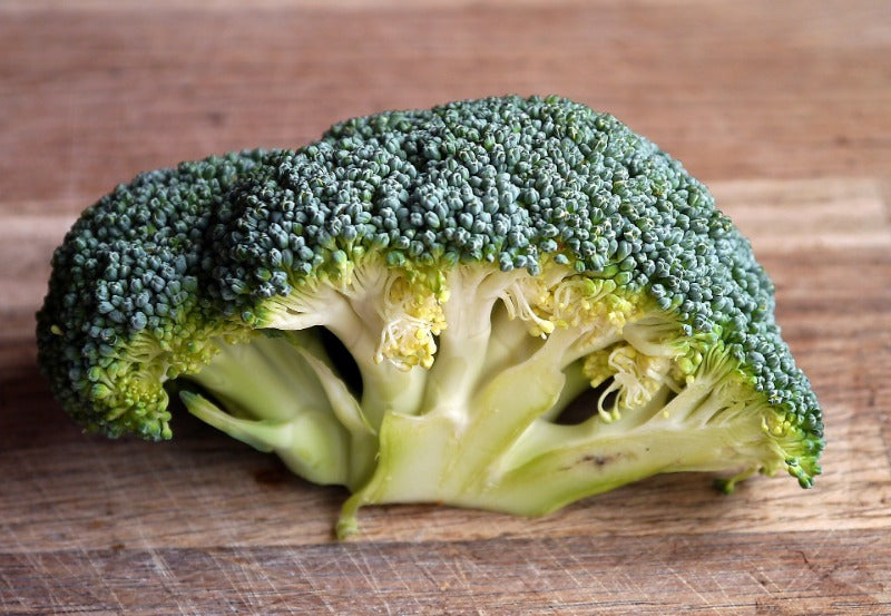 Half of a raw broccoli floret